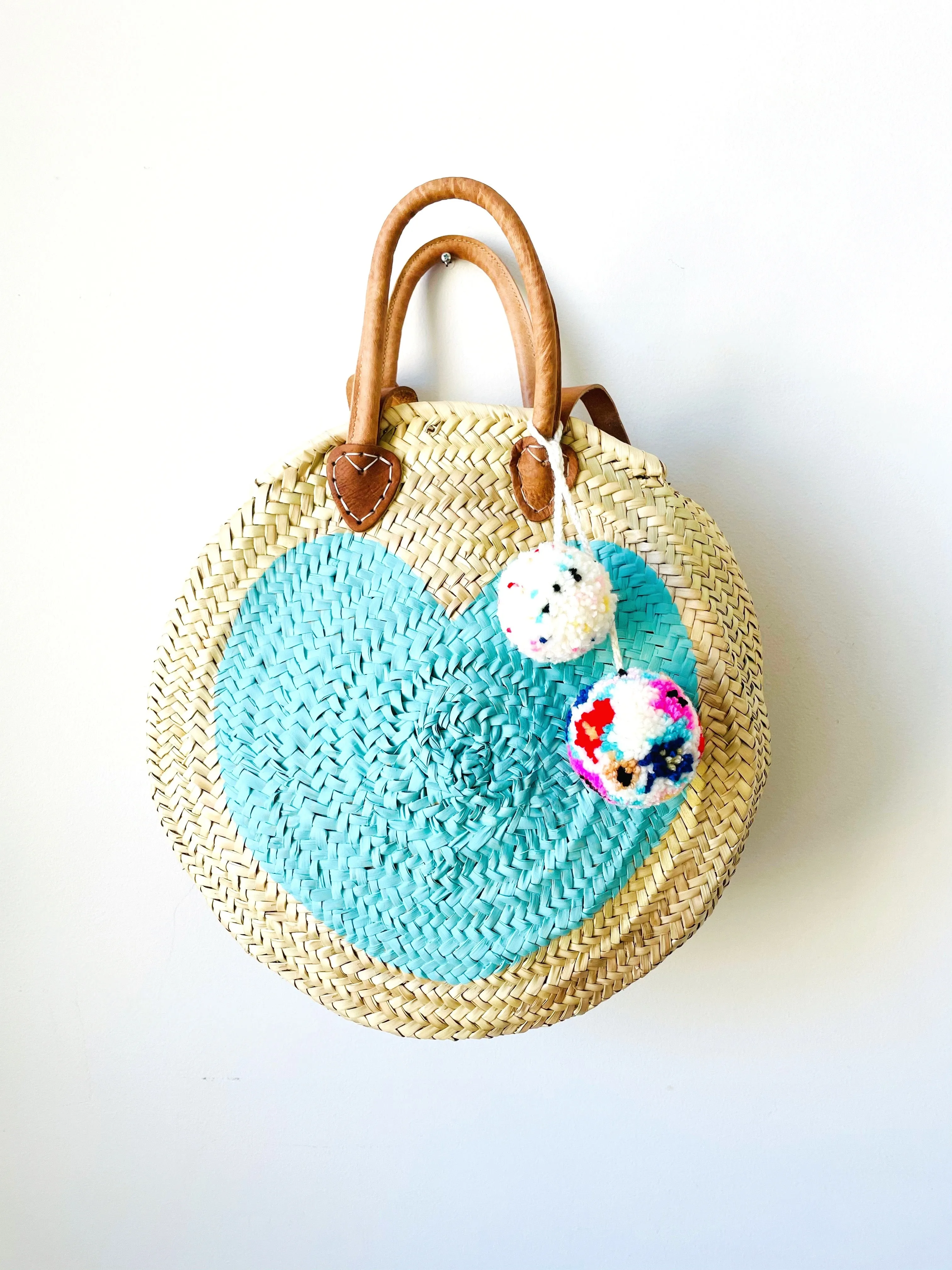 Round  Straw Bag with Leather Straps and Poms by Poppy Joy Pompoms