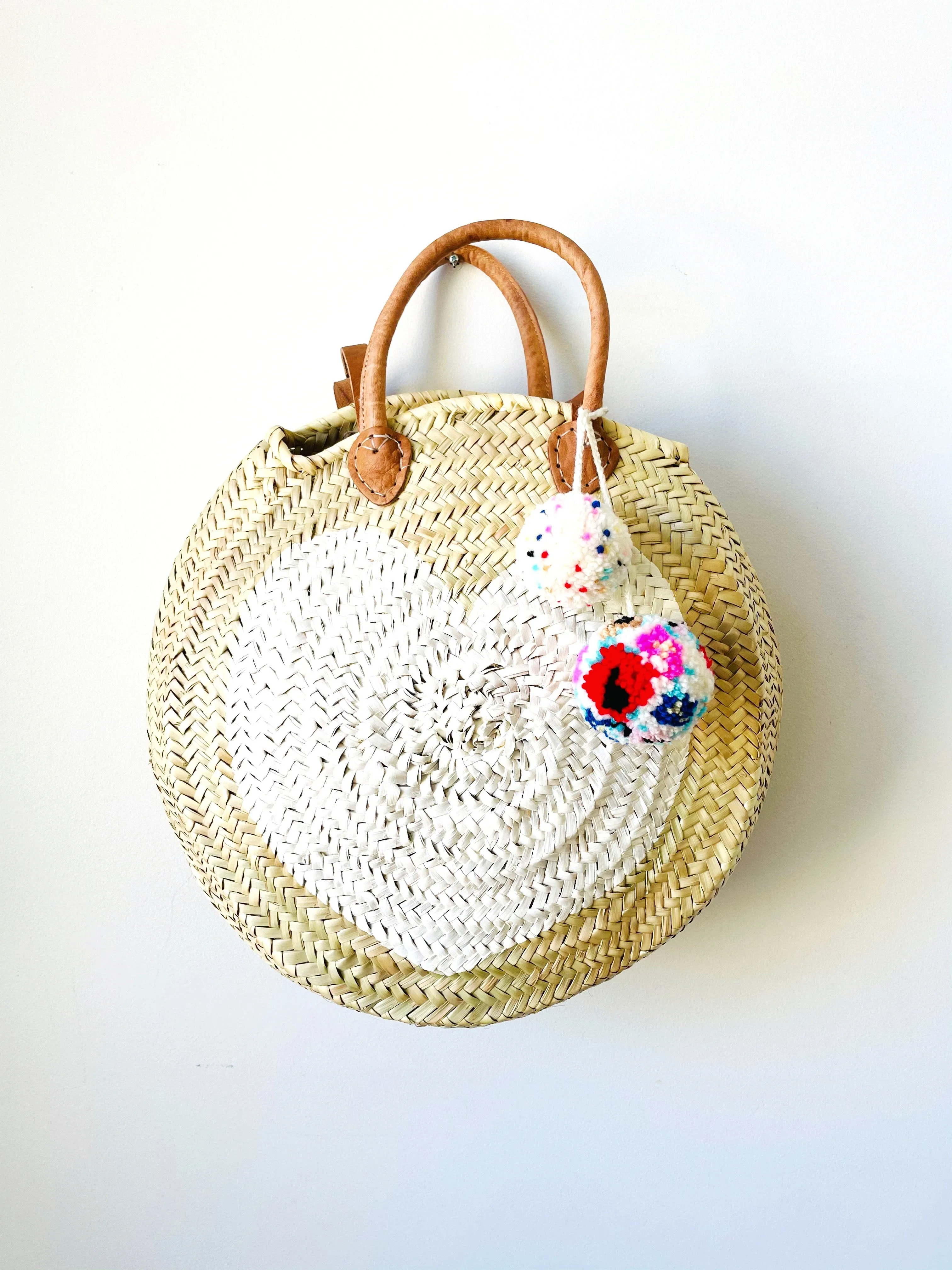 Round  Straw Bag with Leather Straps and Poms by Poppy Joy Pompoms